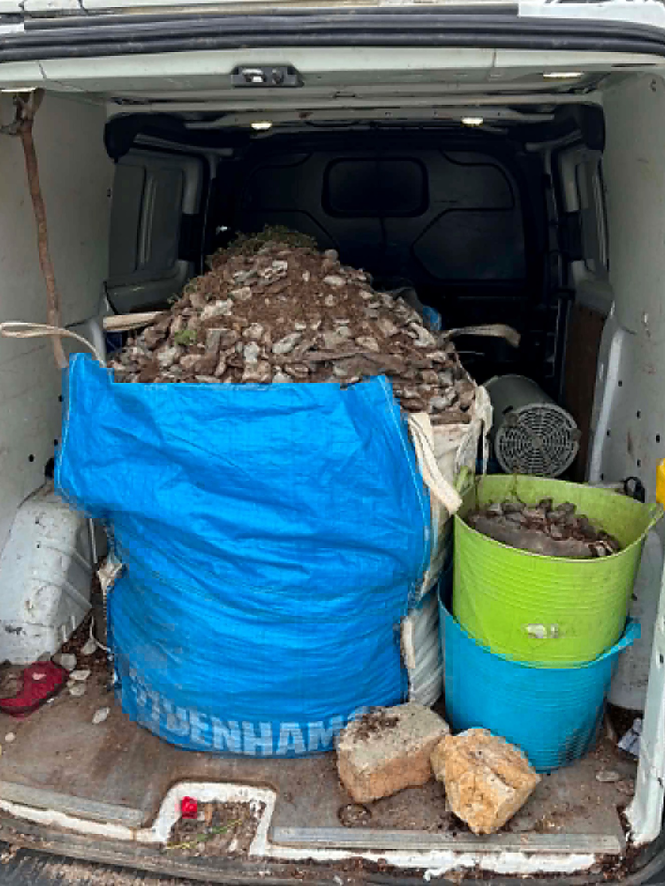 Van loaded with rubble and waste for disposal
